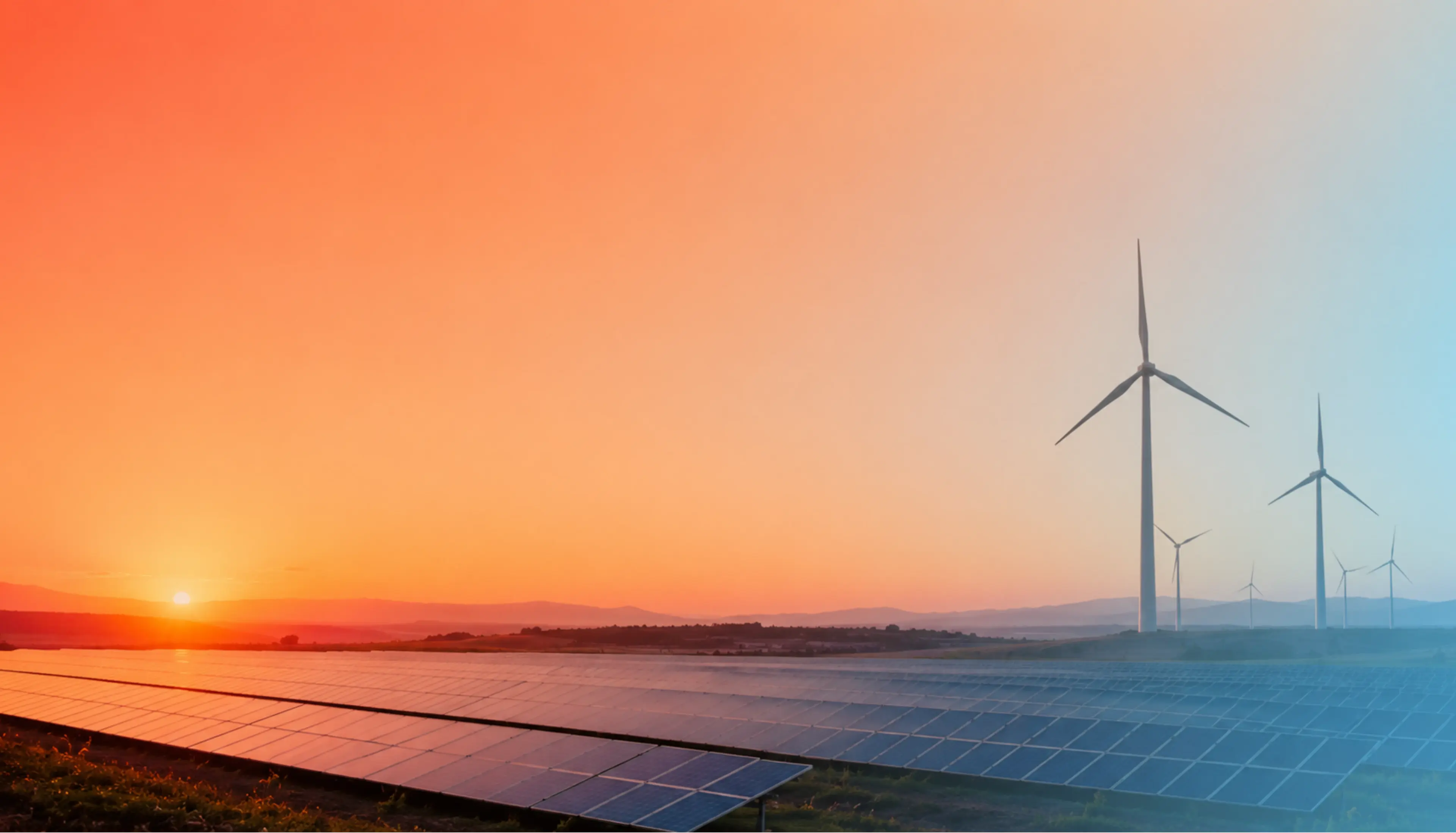 Solar panels and wind turbines at sunset